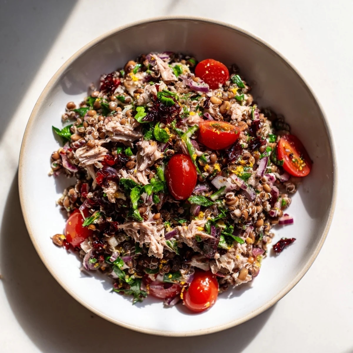 A delicious, textured image of Dense Chickpea and Tuna Salad, ready to enjoy with a squeeze of lemon.