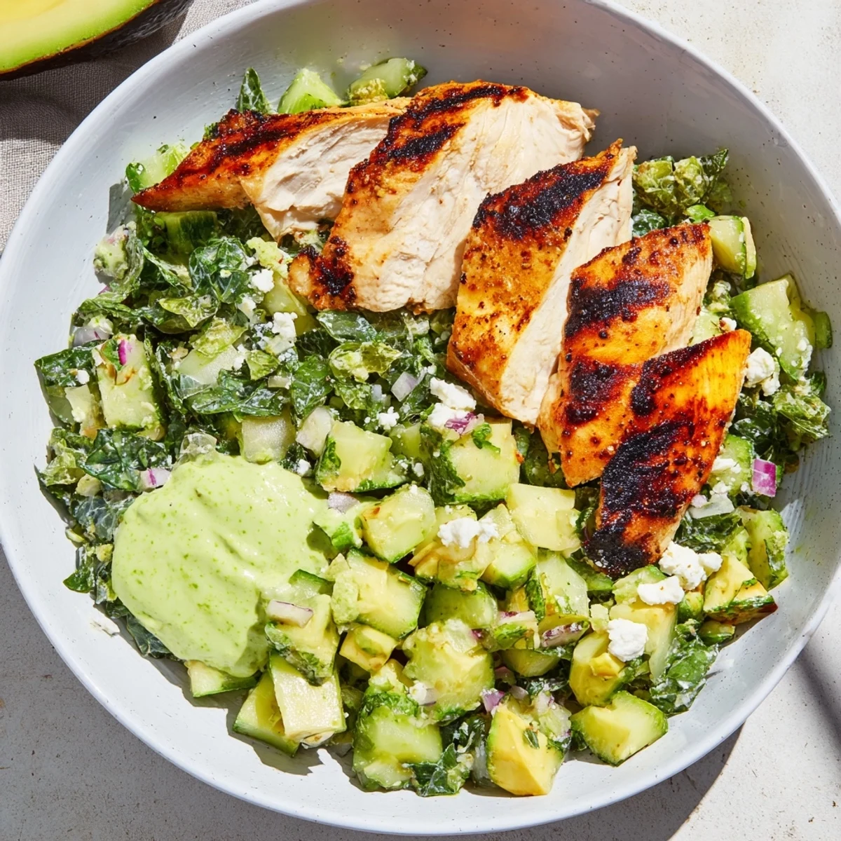 Vibrant Green Goddess Chicken Wraps are packed, with a satisfying crunch from the fresh cabbage salad, ready to eat.