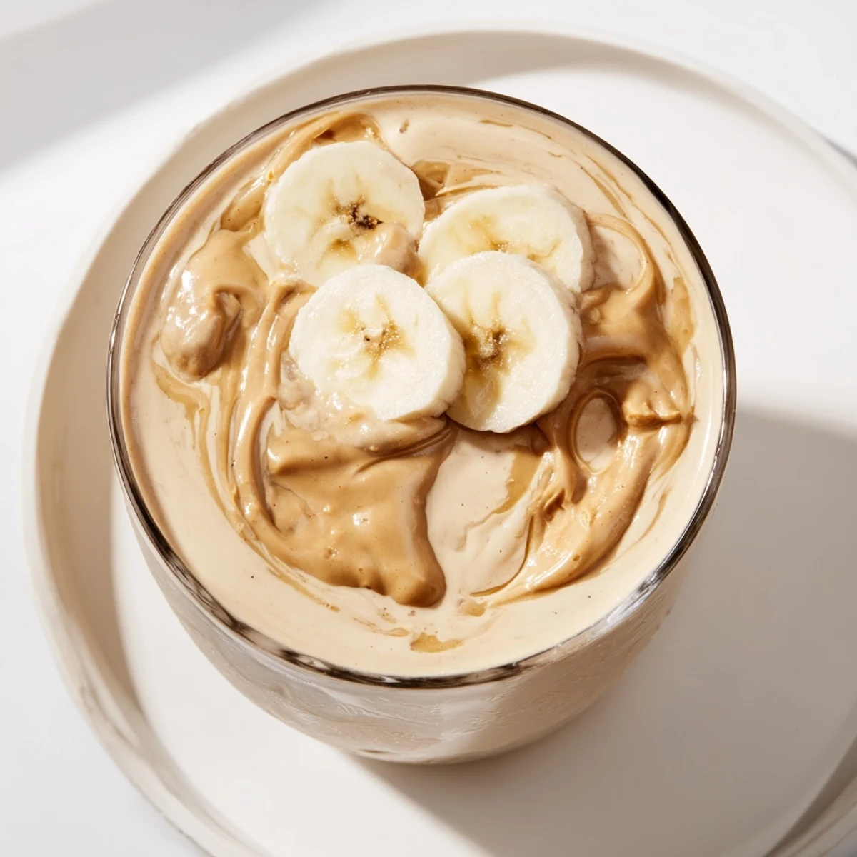 A refreshing Peanut Butter Banana Smoothie; you'll imagine the creamy texture with every sip.