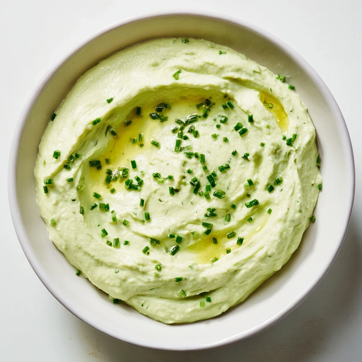 Creamy Avocado Cottage Cheese Dip, a vibrant green dip ready to serve with crunchy vegetables.