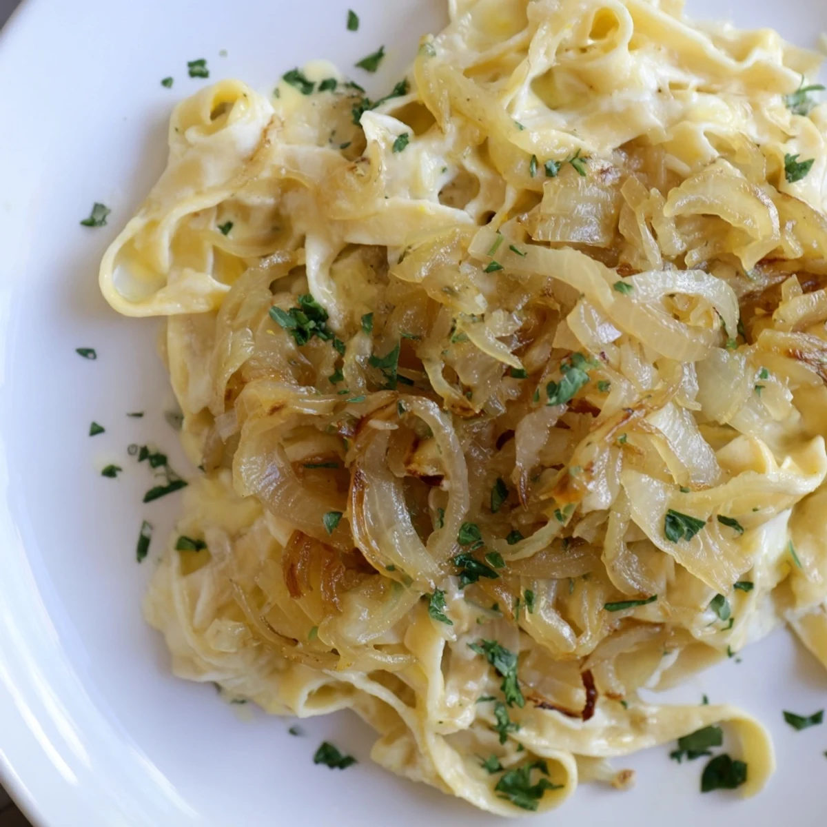 Golden and caramelized onions simmer with fettuccine in this one-pot French Onion Pasta.
