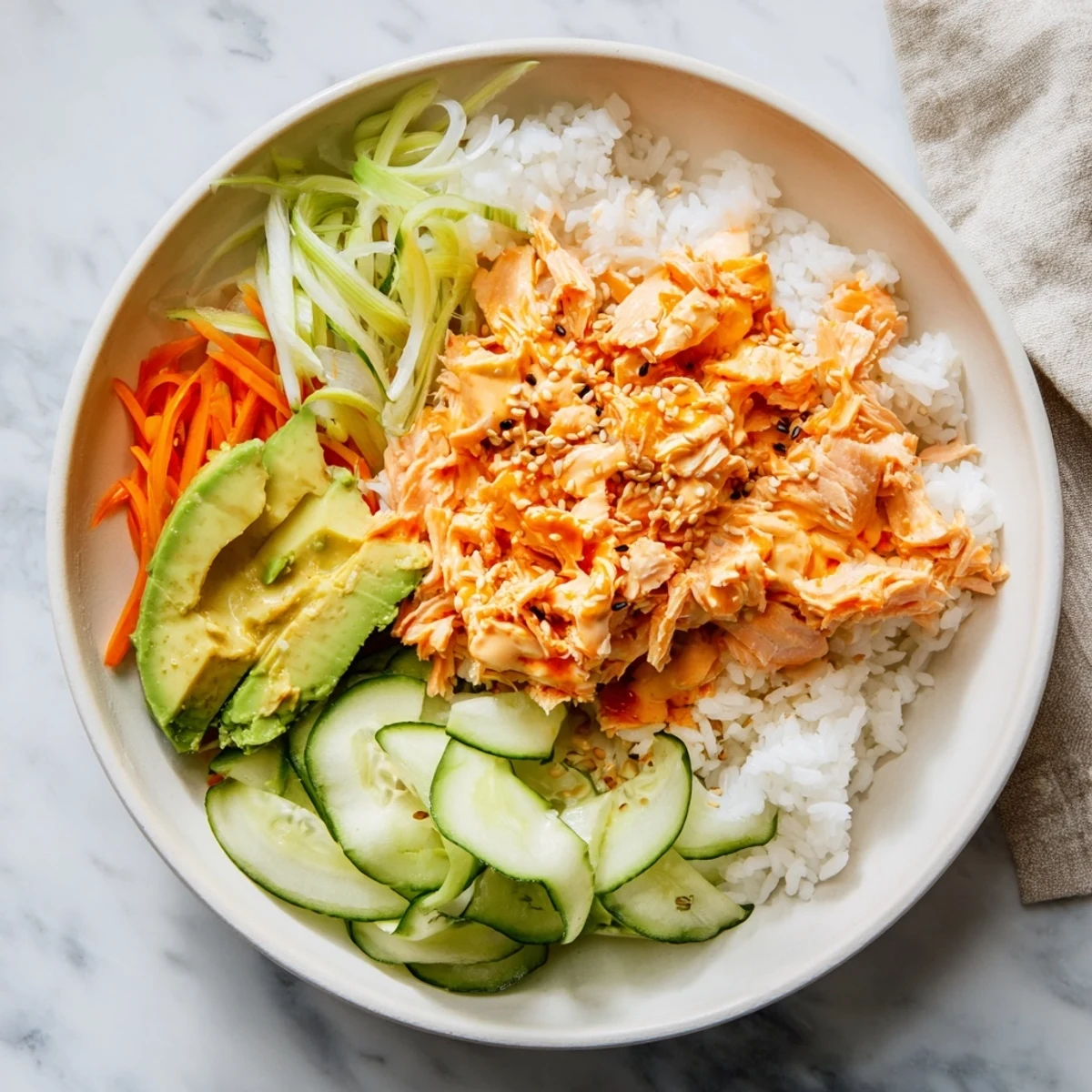 Enjoy this healthy and flavorful Spicy Canned Salmon Rice Bowl; a fast and satisfying meal.