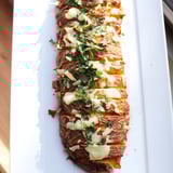 This vegetarian Cheesy Potato Crust Casserole Bake features a crispy potato base and a cheesy, creamy top.