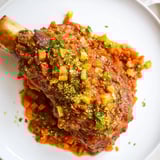 Braised veal shanks, the star of this comforting Osso Buco, look perfectly fork-tender and juicy.