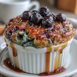 Golden-brown baked oatmeal filled with fresh blueberries, ideal for meal prep mornings.