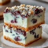 Refreshing no-bake lemon blueberry cheesecake bars featuring a graham cracker crust.