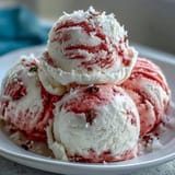 A dollop of vibrant Watermelon Coconut Hand-Churned Ice Cream, dairy-free and delicious.