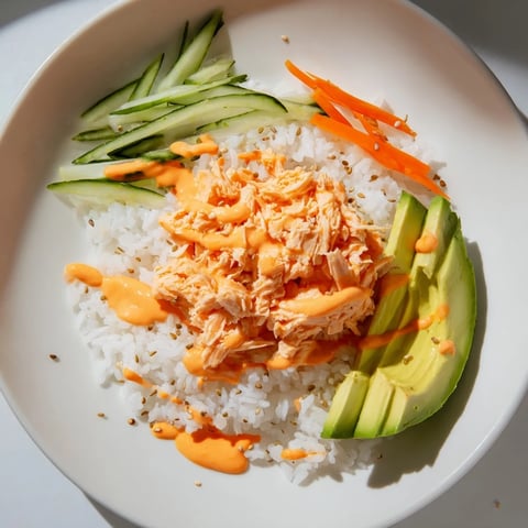Steaming bowl of Spicy Canned Salmon Rice Bowl with colorful vegetables, ready to eat.