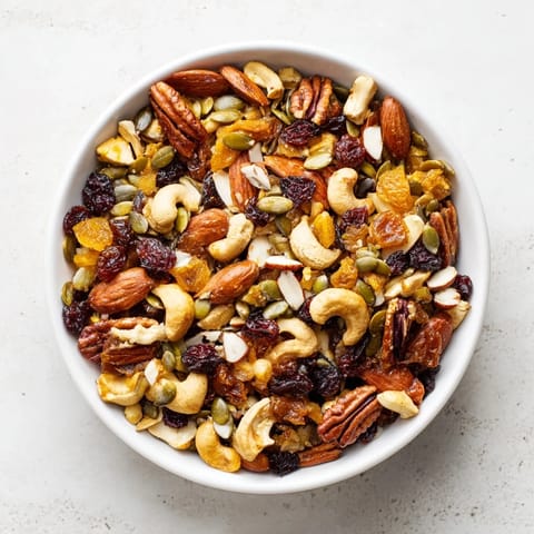 A bowl of homemade Nutty Nosh Squirrel Snack Mix, offering a savory and sweet flavor combination.