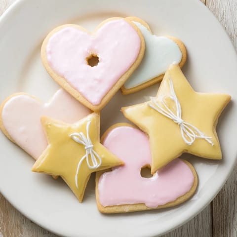 Delicate vanilla essence fills the air around freshly baked Mignonneries Coeurs et Étoiles cookies, ready for gifting.