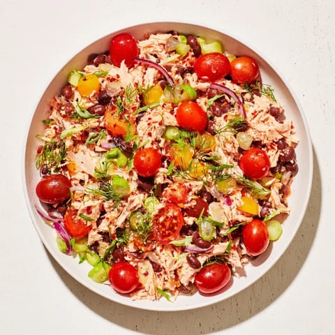 Flaky tuna and chickpeas make up this vibrant Dense Chickpea and Tuna Salad, a perfect lunch now!