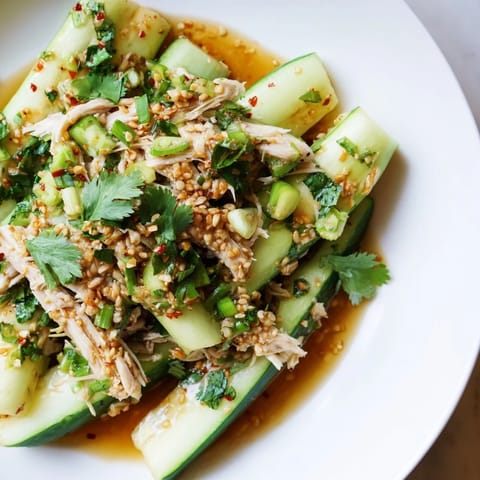 Vibrant image of the Whole Cucumber Logan Salad, featuring refreshing cucumbers and tender chicken pieces.