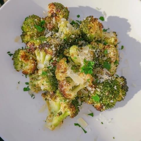 Close-up of Garlic Parmesan Roasted Broccoli, showcasing the roasted garlic's delicious aroma.