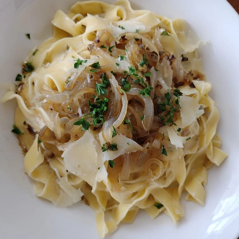 A cheesy, bubbling image of French Onion Pasta, ready for a comforting and delicious meal.