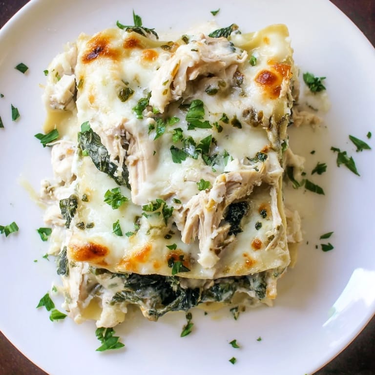 Comforting Chicken Alfredo Lasagna with rich sauce and tender shredded chicken.