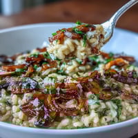 Creamy risotto with sweet caramelized onions and earthy mushrooms, finished with Parmesan and fresh parsley.  