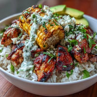 Street Corn Chicken Rice Bowls bursting with colorful toppings and creamy dressing.
